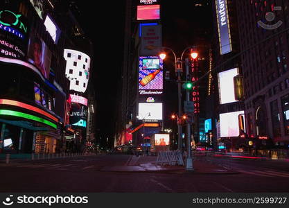 Buildings lit up at night in a city, New York City, New York State, USA