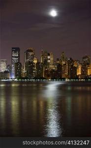 Buildings lit up at night, New York City, New York State, USA