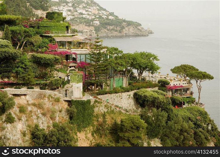 Buildings on a coast, Amalfi Coast, Maiori, Salerno, Campania, Italy