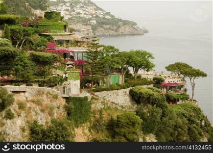 Buildings on a coast, Amalfi Coast, Maiori, Salerno, Campania, Italy