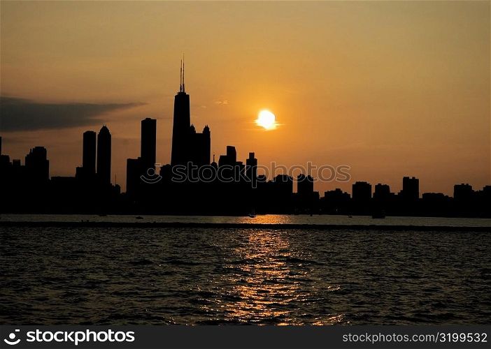 Buildings on a waterfront at sunset, Chicago, Illinois, USA