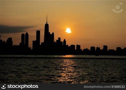 Buildings on a waterfront at sunset, Chicago, Illinois, USA