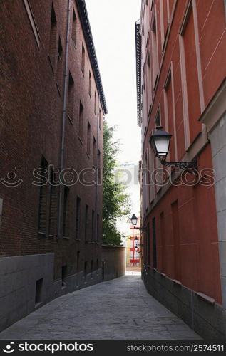 Buildings on both sides of an alley, Madrid, Spain
