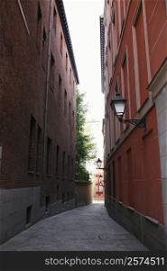 Buildings on both sides of an alley, Madrid, Spain