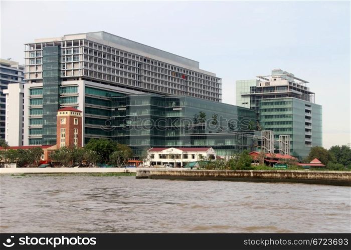 Buildings on the bank of Chao Phraya river in Bangkok, Thailand