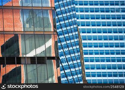 Buildings reflected in urban skyscraper