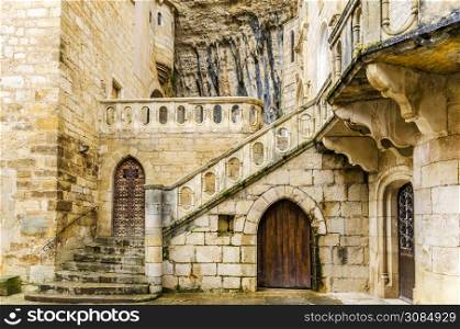 built under a mountain of rocks is located this the shrine of rocamadour place of built under a mountain of rocks is located this the shrine of rocamadour place of pilgrimage in the image we see an external courtyard of the same in the image we see an inner courtyard of the same