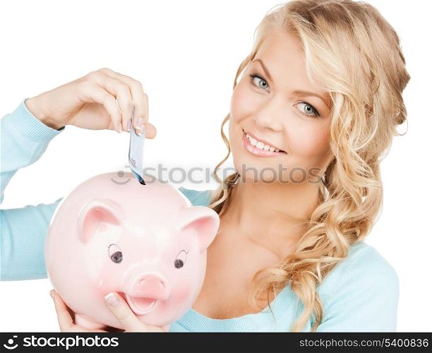 buisness, banking and savings concept - happy businesswoman puts cash money into big piggy bank