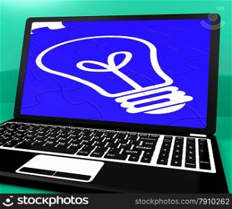 . Bulb Puzzle On Notebook Showing Computer Energy And Online Creativity