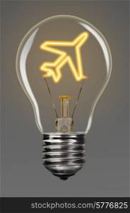 bulb with glowing airplane inside of it, creativity concept