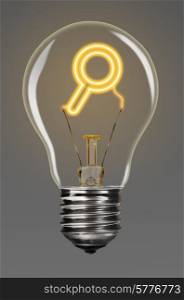 bulb with glowing magnifying glass inside of it, creativity concept