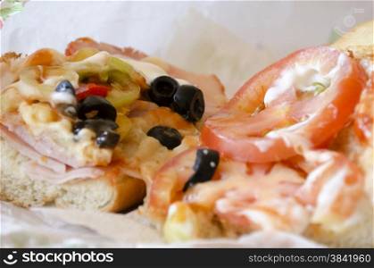 Bulgaria sandwich with tomatoes,olives,cheese,meet and mayonnaise fresh baguette