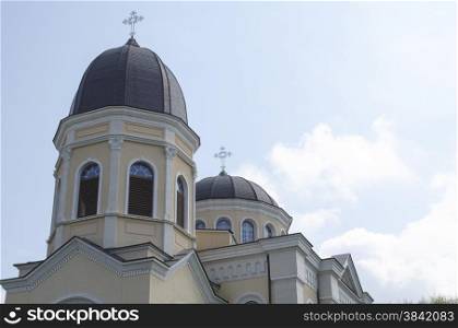 Bulgarian church with cross on blue sky