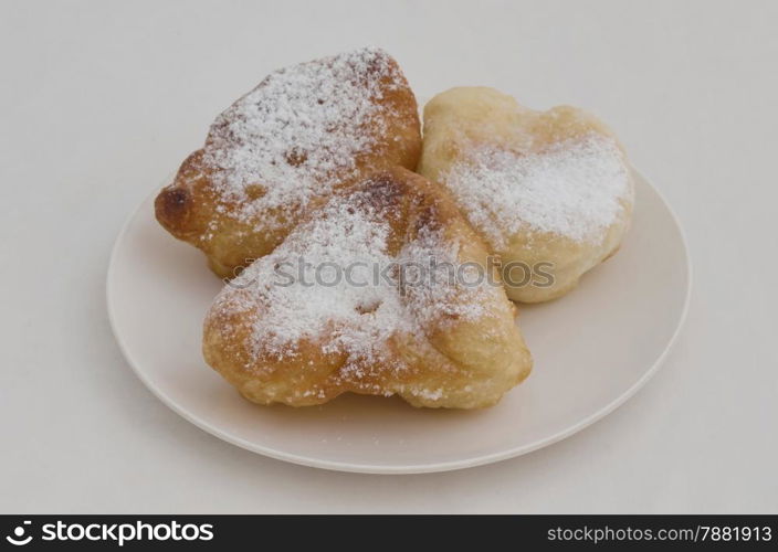 Bulgarian mekitsa (or mekica).Batter fried in deep oil with sugar powder, bulgarian breakfast, traditional cuisine.