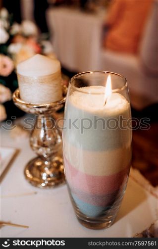 bulk candle - a vase with layered colored sand