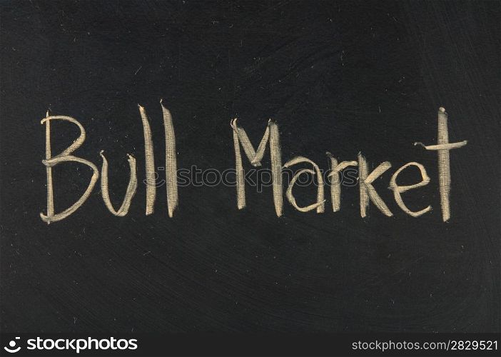 Bull Market in financial business and success in rising stock prices. on blackboard