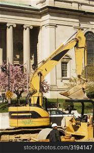 Bulldozer in front of a building