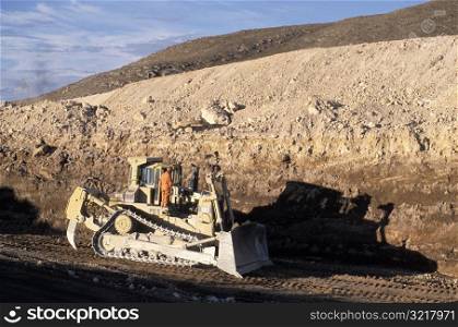 Bulldozer Working in Pit