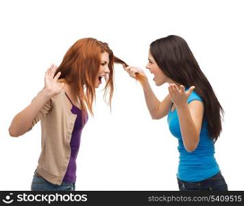 bullying, friendship and people concept - two teenagers having a fight and getting physical