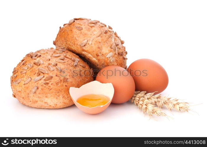 Bun with seeds and broken egg isolated on white background