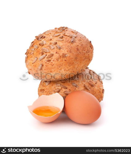 Bun with seeds and broken egg isolated on white background