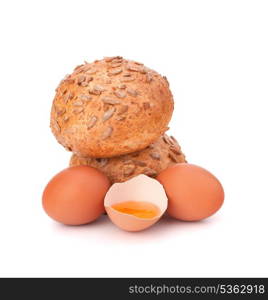 Bun with seeds and broken egg isolated on white background