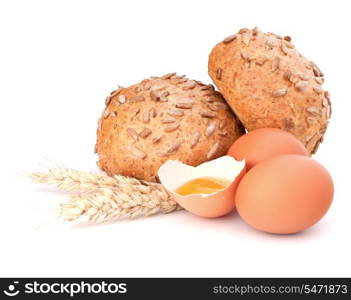 Bun with seeds and broken egg isolated on white background