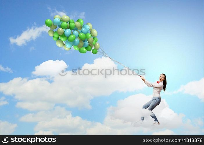 Bunch of balloons. Young pretty woman with big bunch of colorful balloons