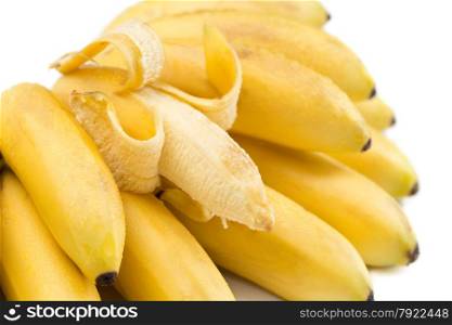 Bunch of bananas with open one isolated on white.