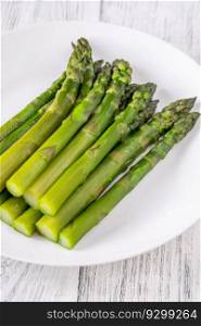 Bunch of boiled asparagus on white background