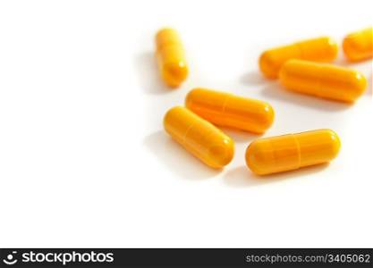 bunch of capsules on white background