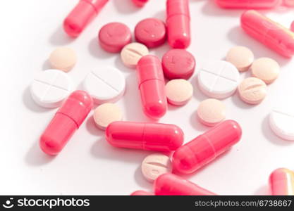 bunch of capsules on white background