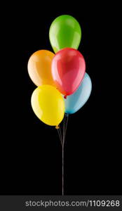 Bunch of colorful balloons isolated on black