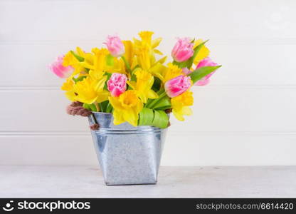 Bunch of colorful double tulips flowers in pot on white background. Bouquet of tulips flowers