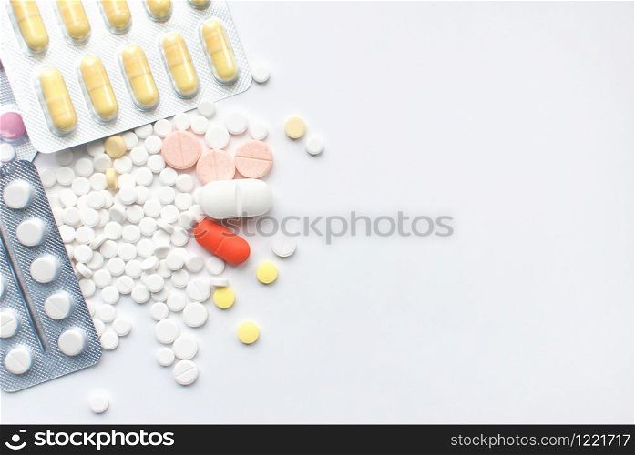 Bunch of colorful Medical Pills and tablets on white background. closeup. Healthcare and medicine. Medical pharmacy concept. Health day. Copyspace. Top view. Bunch of colorful Medical Pills on white background. closeup. Healthcare and medicine. Medical pharmacy concept. Health day