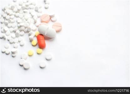 Bunch of colorful Medical Pills on white background. closeup. Healthcare and medicine. Medical pharmacy concept. Health day. Copyspace. Top view. Bunch of colorful Medical Pills on white background. closeup. Healthcare and medicine. Medical pharmacy concept. Health day