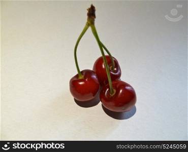 bunch of fresh cherries on a white background