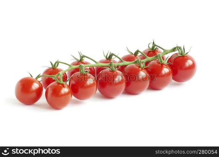 bunch of fresh cherry tomato on white background