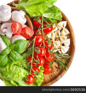 Bunch of fresh cherry tomato with basil, pasta and mushrooms, on white background