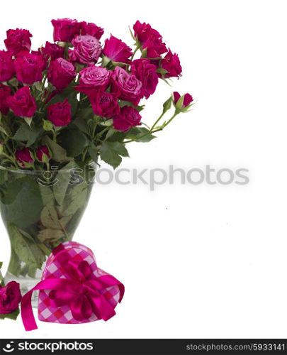 bunch of fresh mauve roses in glass vase with heart gift box isolated on white background. bunch of fresh mauve roses