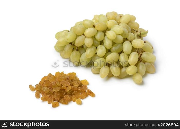 Bunch of fresh ripe Turkish Sultana grapes and dried raisins isolated on white background