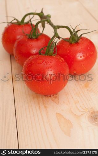 Bunch of Fresh Tomatoes on Wooden Table