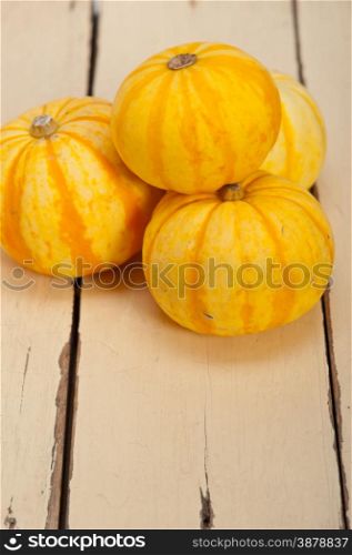 bunch of fresh yellow pumpkins just collected from garden