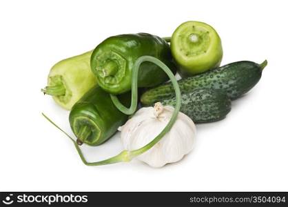 bunch of garlic, peppers and cucumbers isolated on white background