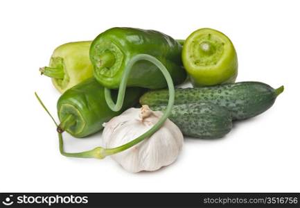 bunch of garlic, peppers and cucumbers isolated on white background