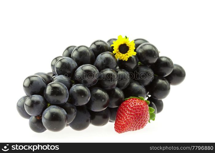 bunch of grapes with a flower and strawberries isolated on white
