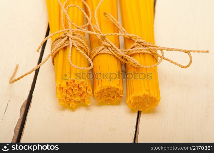 bunch of Italian pasta type on a white rustic table