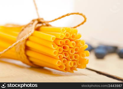 bunch of Italian pasta type on a white rustic table