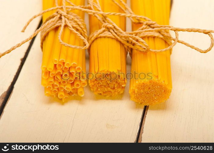 bunch of Italian pasta type on a white rustic table