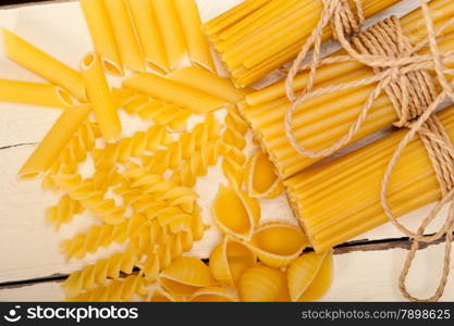 bunch of Italian pasta type on a white rustic table